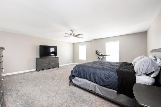carpeted bedroom with baseboards and a ceiling fan