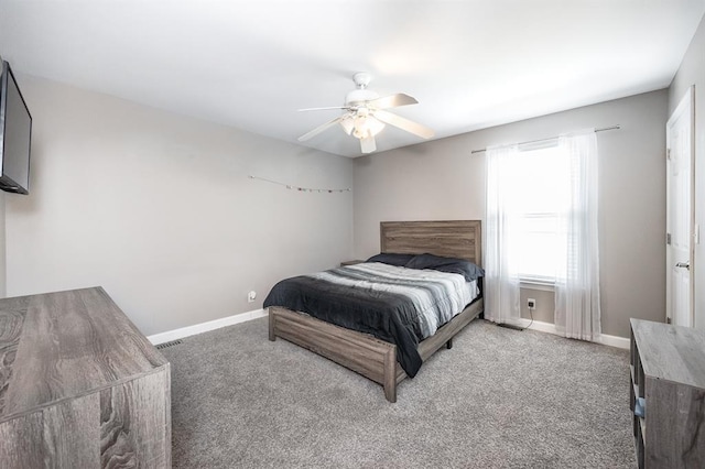 bedroom featuring carpet floors, baseboards, and ceiling fan