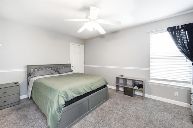 bedroom featuring carpet flooring, baseboards, and a ceiling fan
