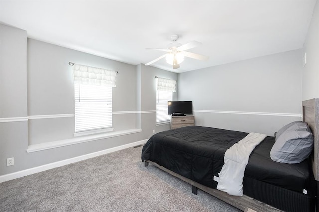 bedroom featuring carpet, baseboards, and a ceiling fan