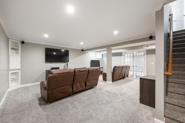 carpeted home theater with crown molding, baseboards, recessed lighting, and built in shelves