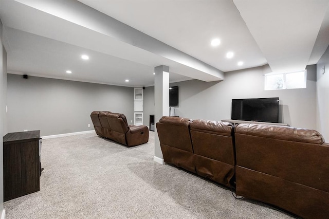 carpeted living area featuring baseboards and recessed lighting