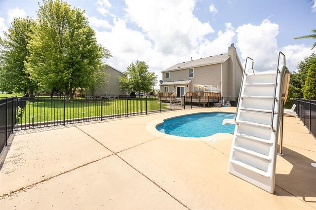 view of pool with a deck and a patio