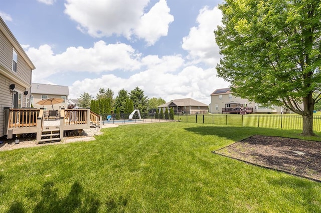 view of yard with a wooden deck