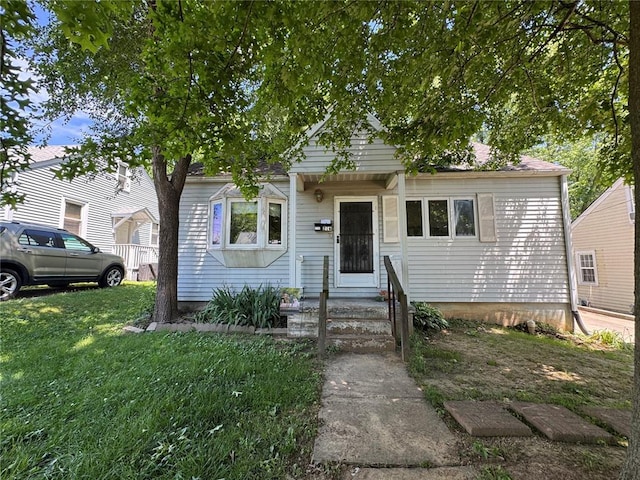 view of front of property with a front lawn