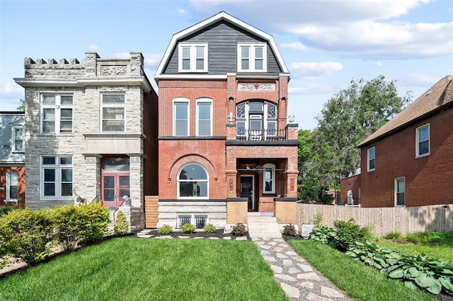 3235 S Jefferson Ave, Saint Louis, MO 63118 - view of front of home with a gambrel roof, brick siding, and a balcony