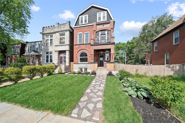 3235 S Jefferson Ave, Saint Louis, MO 63118 - view of front of house featuring brick siding, a balcony, and stone siding