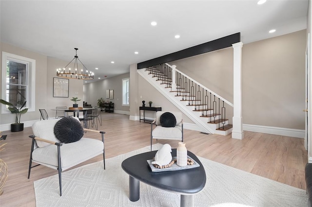 3235 S Jefferson Ave, Saint Louis, MO 63118 - living area featuring wood finished floors, baseboards, stairway, a chandelier, and recessed lighting