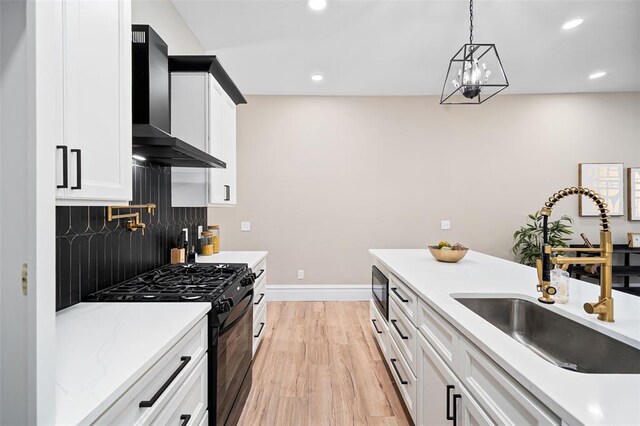 3235 S Jefferson Ave, Saint Louis, MO 63118 - kitchen featuring black appliances, wall chimney range hood, a sink, decorative backsplash, and white cabinetry