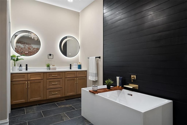 3235 S Jefferson Ave, Saint Louis, MO 63118 - bathroom featuring wood walls, a soaking tub, and double vanity