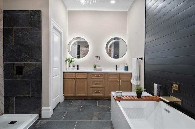 3235 S Jefferson Ave, Saint Louis, MO 63118 - bathroom featuring double vanity, tiled shower, a freestanding bath, and tile patterned floors