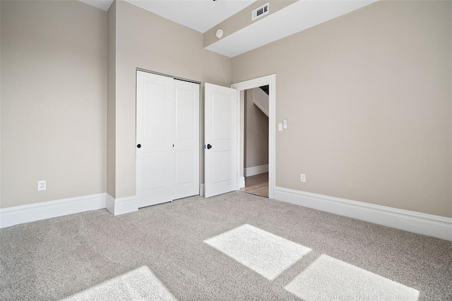 3235 S Jefferson Ave, Saint Louis, MO 63118 - unfurnished bedroom with carpet flooring, a closet, and baseboards