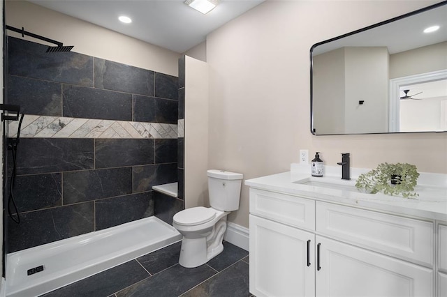 3235 S Jefferson Ave, Saint Louis, MO 63118 - full bath featuring toilet, vanity, a tile shower, baseboards, and recessed lighting
