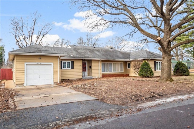 single story home with a garage, asphalt driveway, fence, and roof with shingles
