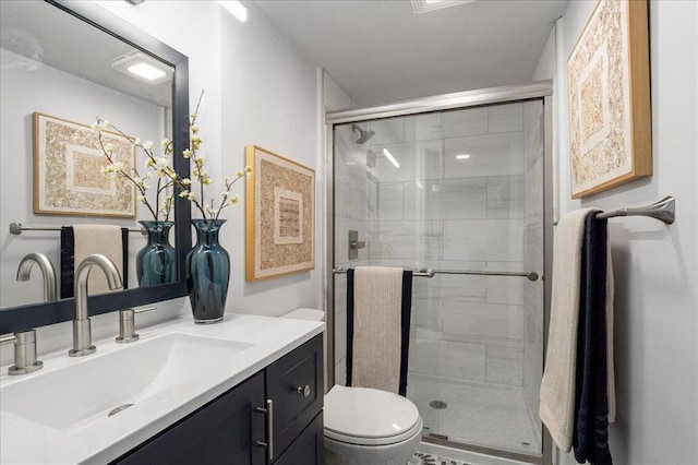full bathroom with a shower stall, toilet, and vanity