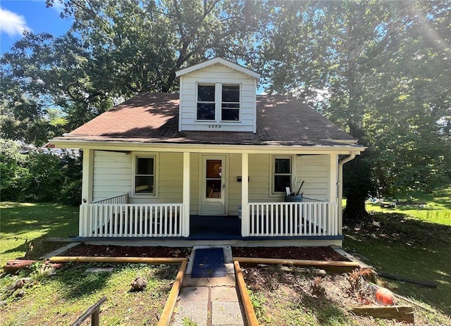 1305 Clawson St, Alton, IL 62002 - view of front of house featuring a porch, a front yard, and a shingled roof