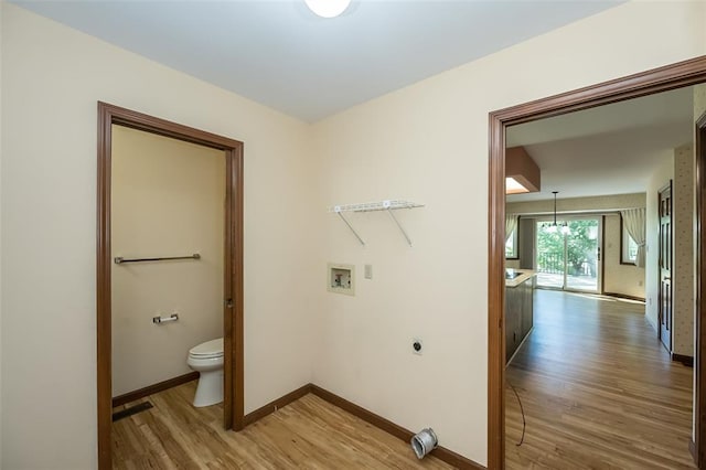 14 Wimbly Pl, Saint Charles, MO 63301 - laundry area featuring light wood-style floors, baseboards, washer hookup, and hookup for an electric dryer
