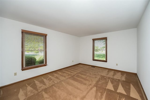 14 Wimbly Pl, Saint Charles, MO 63301 - spare room featuring baseboards and carpet flooring