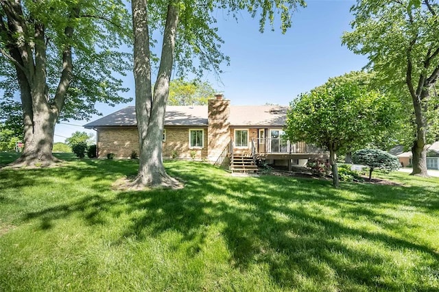 14 Wimbly Pl, Saint Charles, MO 63301 - rear view of property featuring a wooden deck, a chimney, and a lawn