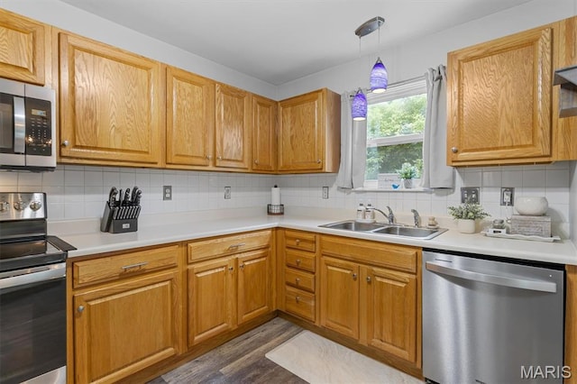 1332 Big Bend Crossing Dr, Manchester, MO 63088 - kitchen with stainless steel appliances, dark wood-style flooring, tasteful backsplash, and light countertops