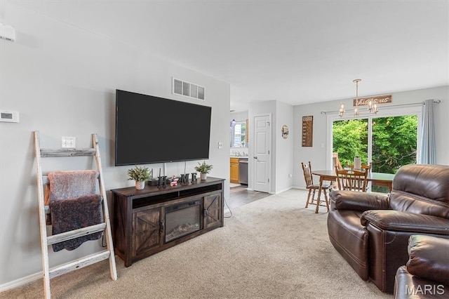 1332 Big Bend Crossing Dr, Manchester, MO 63088 - living area with light colored carpet, a chandelier, and plenty of natural light
