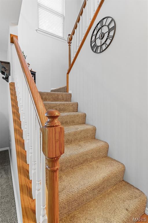 1332 Big Bend Crossing Dr, Manchester, MO 63088 - stairs featuring baseboards and carpet