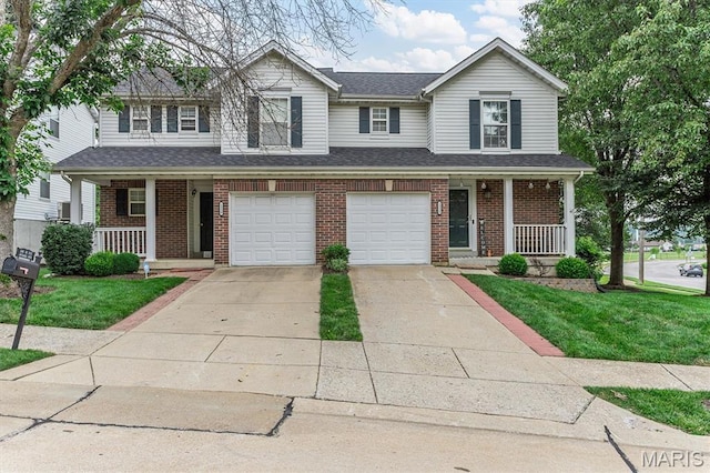 1332 Big Bend Crossing Dr, Manchester, MO 63088 - traditional-style house with a porch, driveway, and brick siding