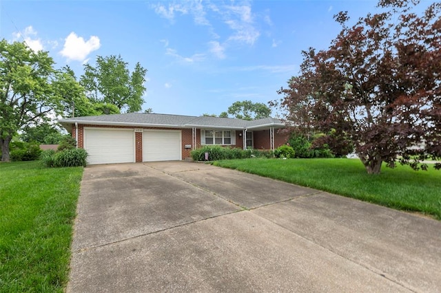 626 Sue Dr, Jackson, MO 63755 - ranch-style home featuring an attached garage, brick siding, concrete driveway, and a front yard