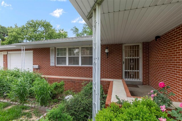 626 Sue Dr, Jackson, MO 63755 - entrance to property with brick siding and an attached garage