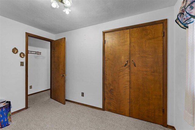 626 Sue Dr, Jackson, MO 63755 - unfurnished bedroom featuring carpet floors, baseboards, and a closet