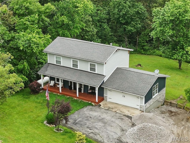 425 Cedar Ln, Wentzville, MO 63385 - view of front of house with a porch, driveway, a front lawn, and a garage