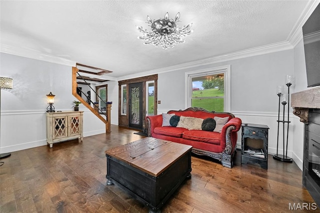 425 Cedar Ln, Wentzville, MO 63385 - living room with stairway, wood finished floors, crown molding, a wainscoted wall, and a textured ceiling
