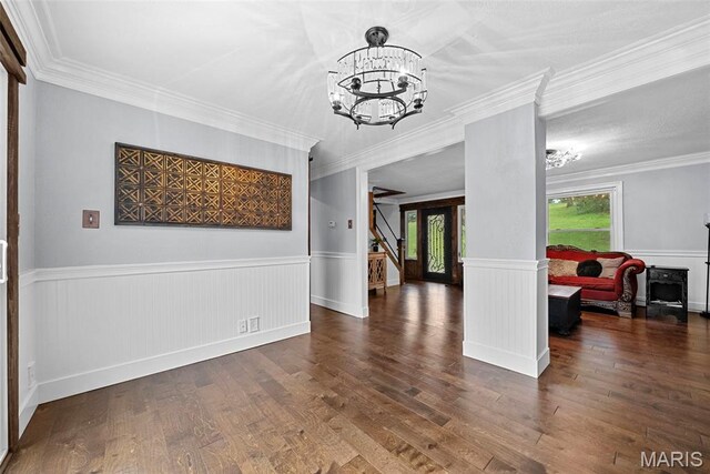 425 Cedar Ln, Wentzville, MO 63385 - dining area with a chandelier, wainscoting, wood finished floors, and ornamental molding