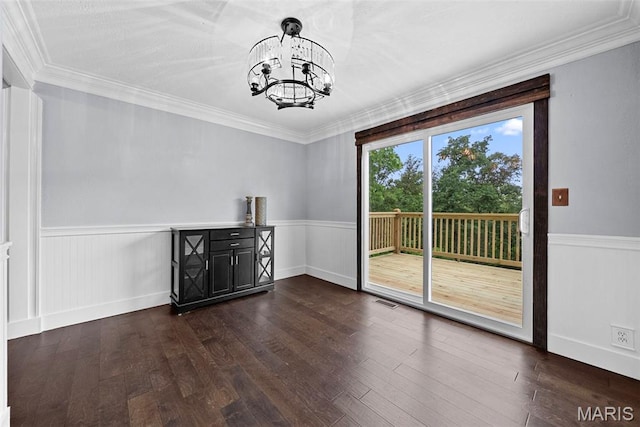 425 Cedar Ln, Wentzville, MO 63385 - unfurnished dining area featuring a chandelier, dark wood-style floors, a wainscoted wall, and ornamental molding