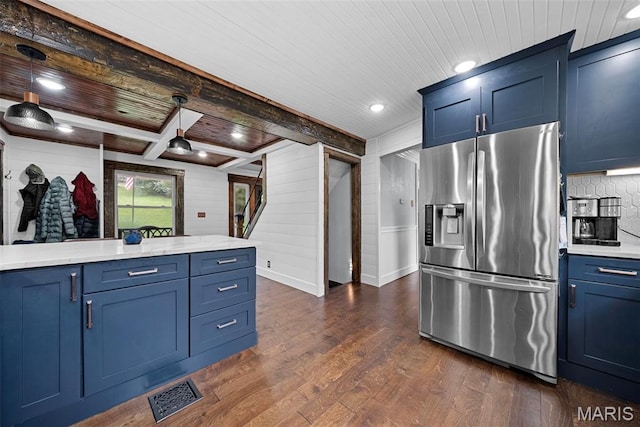 425 Cedar Ln, Wentzville, MO 63385 - kitchen featuring stainless steel refrigerator with ice dispenser, blue cabinetry, dark wood-style flooring, light countertops, and wooden ceiling with exposed beams