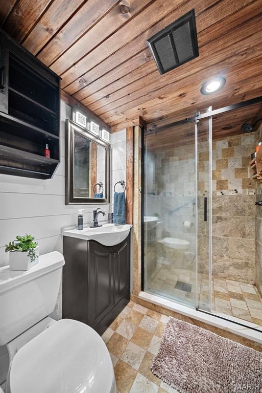 425 Cedar Ln, Wentzville, MO 63385 - bathroom featuring wood ceiling, toilet, vanity, a stall shower, and recessed lighting