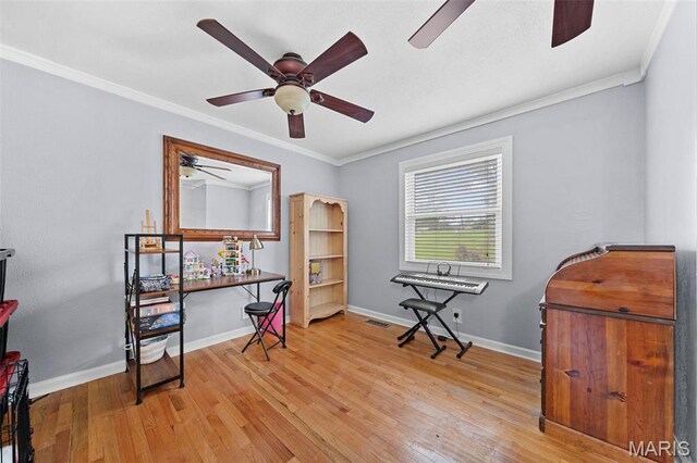 425 Cedar Ln, Wentzville, MO 63385 - misc room featuring a ceiling fan, light wood finished floors, baseboards, and crown molding
