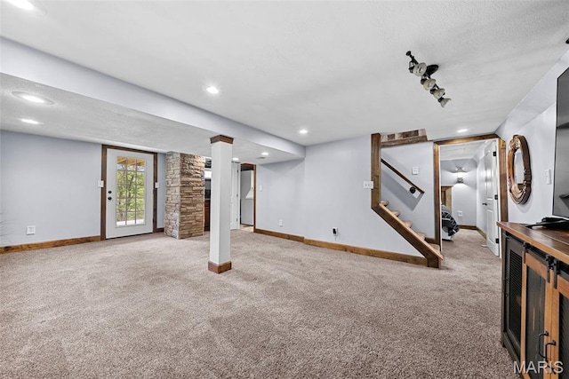 425 Cedar Ln, Wentzville, MO 63385 - below grade area featuring carpet floors, baseboards, stairway, a textured ceiling, and recessed lighting