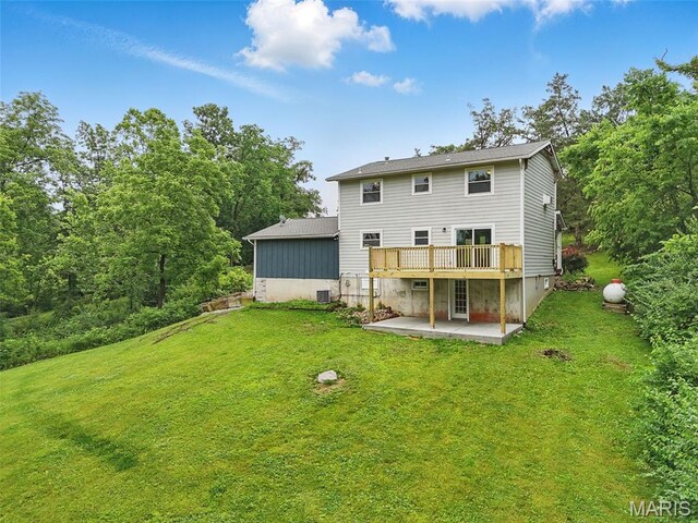 425 Cedar Ln, Wentzville, MO 63385 - back of property with a patio, a lawn, and a deck