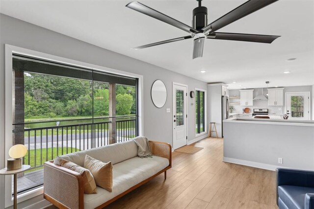 527 W Lake Dr, Edwardsville, IL 62025 - living area featuring light wood-style floors, ceiling fan, recessed lighting, and baseboards