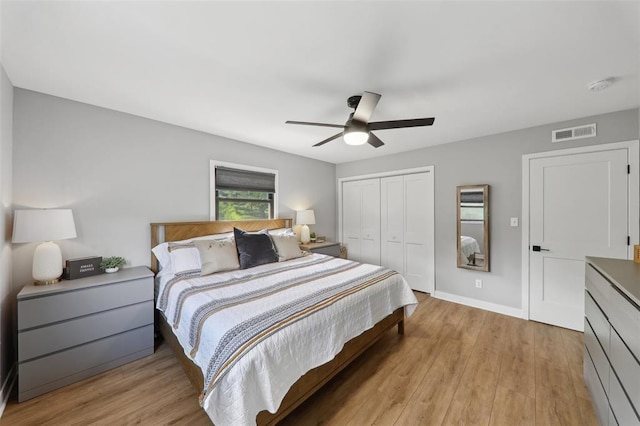 527 W Lake Dr, Edwardsville, IL 62025 - bedroom with a closet, light wood finished floors, ceiling fan, and baseboards