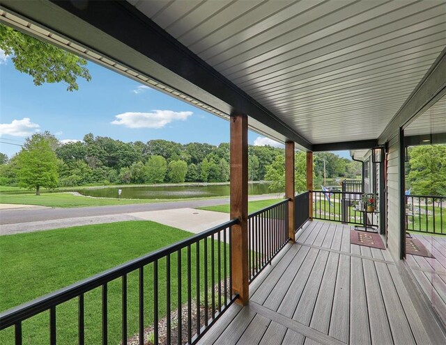 527 W Lake Dr, Edwardsville, IL 62025 - wooden porch with a water view, a lawn, and view of scattered trees