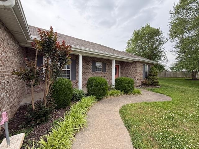1114 Daffodil St, Sikeston, MO 63801 - view of exterior entry featuring brick siding
