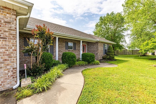 1114 Daffodil St, Sikeston, MO 63801 - doorway to property with brick siding and a shingled roof