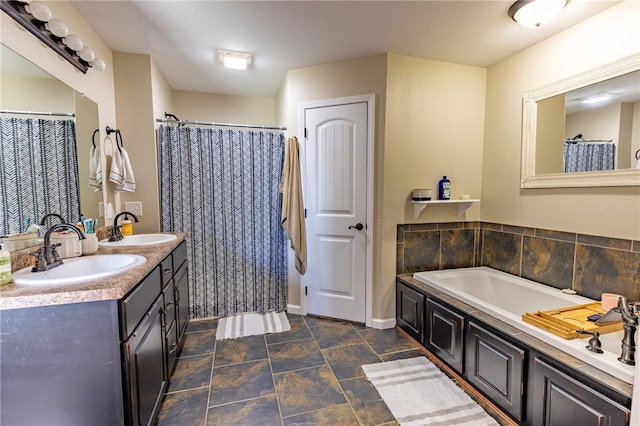 1114 Daffodil St, Sikeston, MO 63801 - full bath with a bath, baseboards, double vanity, and stone finish flooring