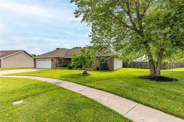 1114 Daffodil St, Sikeston, MO 63801 - view of front facade with brick siding, an attached garage, and driveway