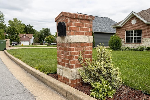 924 Brookside Ln, Rolla, MO 65401 - exterior view of roof with shingles, brick siding, and a downspout