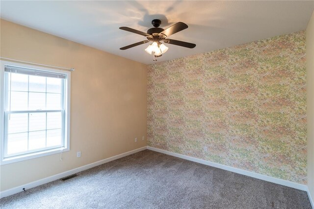 924 Brookside Ln, Rolla, MO 65401 - carpeted empty room with baseboards and a ceiling fan