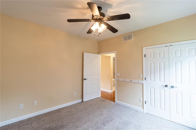 924 Brookside Ln, Rolla, MO 65401 - unfurnished bedroom with carpet, baseboards, a closet, and a ceiling fan