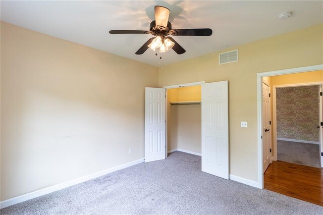 924 Brookside Ln, Rolla, MO 65401 - unfurnished bedroom with carpet flooring, baseboards, a closet, and ceiling fan